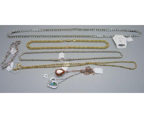 A paste necklace, four silver chains and a bracelet, and one other pendant and chain 