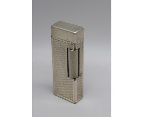 A vintage silver plated Dunhill lighter with engine turned detail 