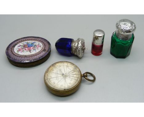 A pocket barometer, a/f, two silver topped scent bottles, a blue glass and white metal topped vinaigrette and an enamelled co