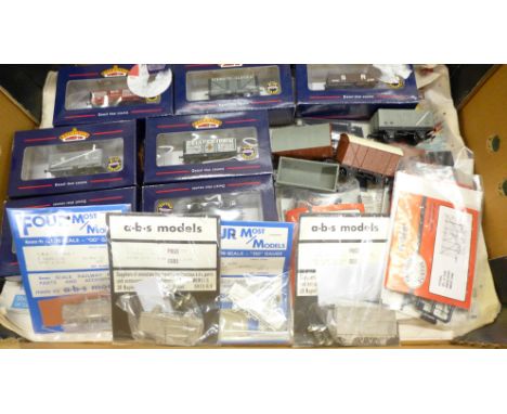 A collection of model train parts, a.b.s models and other sealed sets and seven boxed Bachmann OO gauge wagons, four unboxed 