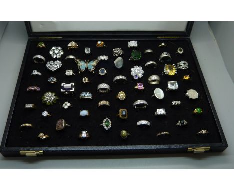 A ring tray and sixty costume rings 