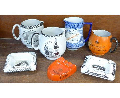 A collection of Scotch Whisky advertising items including Shelley water jugs and three ash trays 