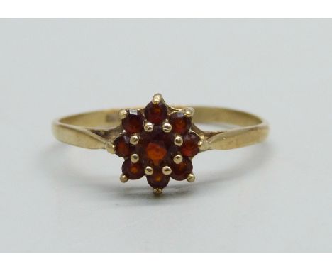 A 9ct gold and garnet cluster ring, 1.4g, S 