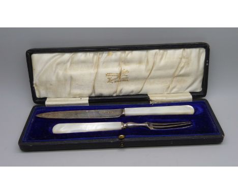 A silver and mother of pearl handled knife and fork christening set, Sheffield 1912, Isaac Ellis &amp; Sons, boxed 