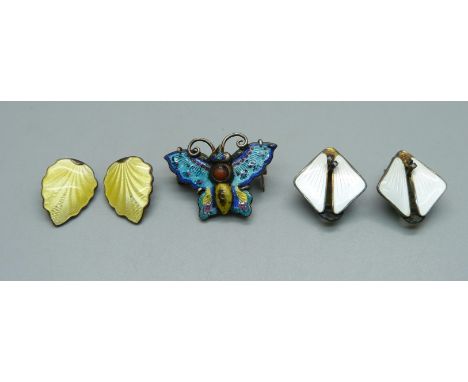 A white metal and enamel butterfly brooch and two pairs of silver and enamel earrings, both marked Norway, white pair also ma