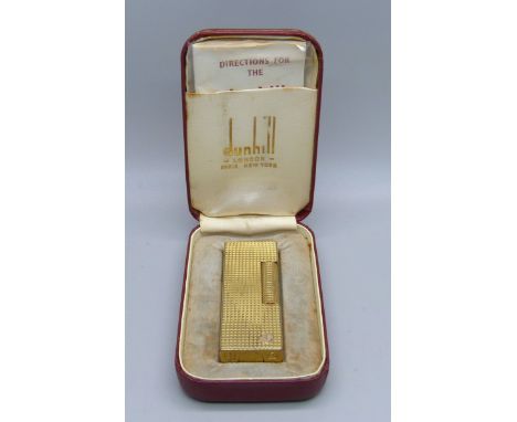 A Dunhill lighter, boxed, with instructions 