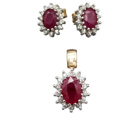 Set Ohrringe und Anhänger mit Diamant- und Rubinbesatz 14 K WG. ca. 3 ct. Rubine, ca. 0.30 ct. Diamanten. Gewicht ca. 3.9 g. 