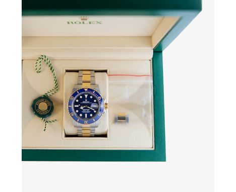 Rolex Submariner Wristwatch reference 126613LB from 2022 offered in unused condition with partial stickers includes; display 