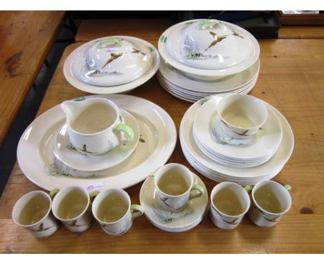 A ROYAL DOULTON 'THE COPPICE' PATTERN No. D5803 DINNER SERVICE depicting pheasants in flight, six place settings, together wi