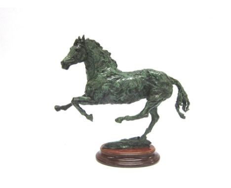 SALLY RUTHERFORD 'Freedom' a bronze verdi gris sculture of a galloping horse, on an oval wooden stand, signed, limited editio