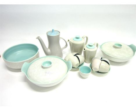A COLLECTION OF POOLE POTTERY TWIN-TONE TABLEWARE comprising: eight coffee cups, six saucers, sugar bowl, coffee, two hot wat