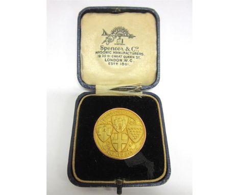 A 9CT GOLD MOTOR CYCLING CLUB LONDON-EXETER MEDAL 1930, awarded to R Jones, for a solo run, 3.2cm diameter, 16.8g gross, in a