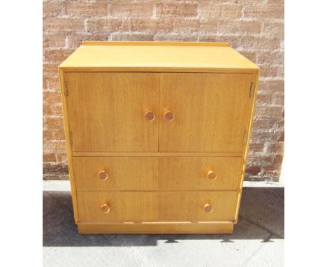 A MERRIDEW 'CASANOVA' LIGHT OAK TALLBOY, with cupboard over two drawers on plinth base, 76cm wide, 46.5cm deep, 86.5cm high N