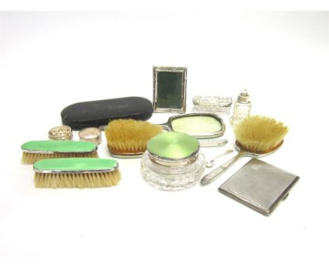 A SIX PIECE SILVER AND ENAMEL DRESSING TABLE SET comprising a powder bowl, two hair brushes, two clothes brushes, and a hand 