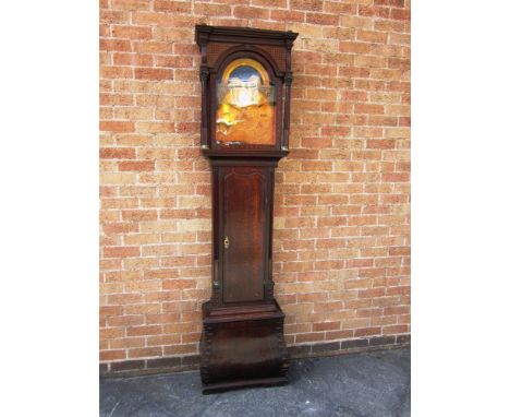 AN 18TH CENTURY EIGHT DAY LONGCASE CLOCK the arched brass dial with seconds dial and date aperture, signed 'Tho. Haden, Dudle