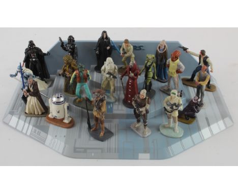 Star Wars. A collection of twenty Lucas Films Star Wars figures, including a De Agostini display stand