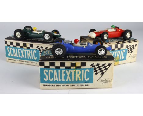 Scalextric. Three boxed Scalextric slot car models, comprising 'Porsche' (C73, red); 'Lotus' (C82, blue); 'Lotus' (C82, green