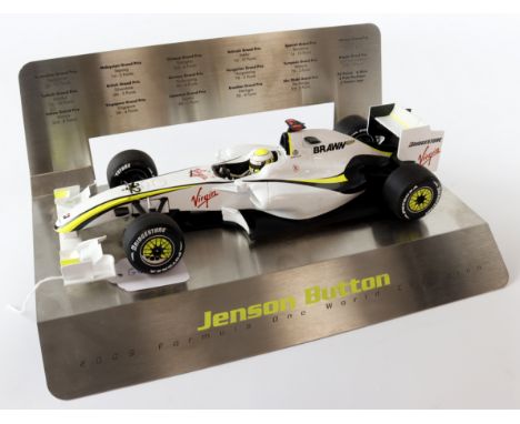 Minichamps 'Brawn' Jenson Button 2009 Formula One World Champion 1:18 scale model, on a metal display stand, height 13cm, len