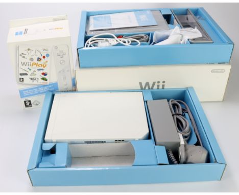 Nintendo Wii boxed console (loos unused), comes with Wii Sports, together with a boxed Wii Remote &amp; Play set (also looks 