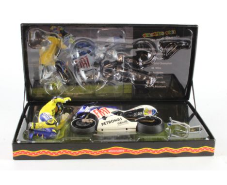 Minichamps boxed 1:12 scale Valentino Rossi Collection model 'Yamaha YZR-M1 Valentino Rossi Moto GP 2010 Valencia' (122 10314