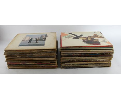 Records. A collection of approximately seventy-five 33rpm albums, artists include Eric Clapton, The Who, Beatles, Pink Floyd,