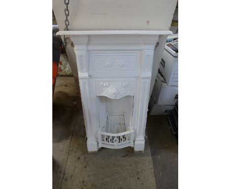 An Art Nouveau painted cast iron fire surround