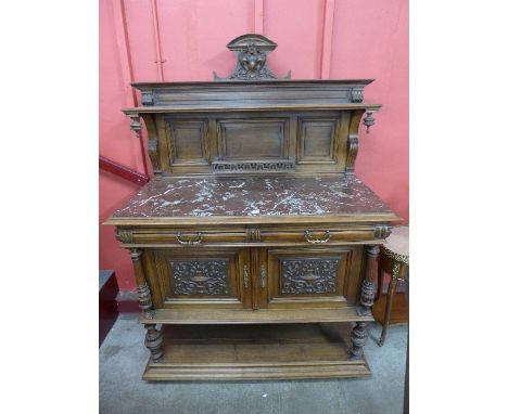 A 19th Century French Henry II style walnut and marble topped buffet