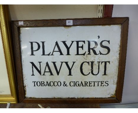 A Player's Navy Cut Tobacco Cigarettes enamel advertising sign, framed