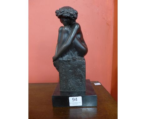 A French style bronze figure of a female, on black marble socle