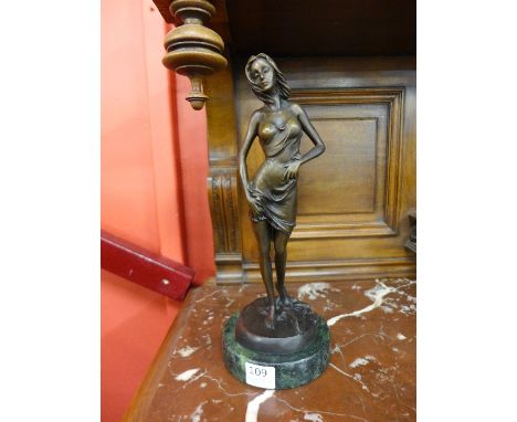 A bronze figure of a lady