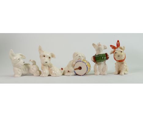 A collection of Beswick comical dogs: including toothache dog, dog playing accordion, dog asleep on drum and two dogs with la