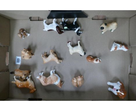 A collection of small Beswick dogs: with Royal Doulton k dog (14) 