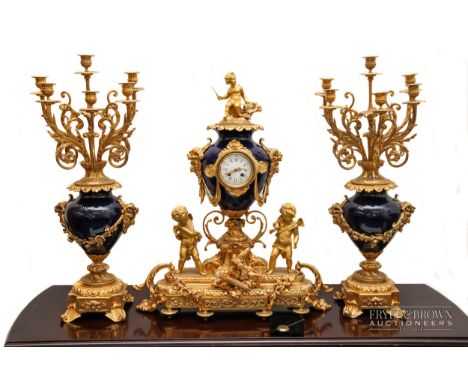 An impressive and large antique clock garniture c1870 by Demuer Du Roi, the ormolu and blue glazed porcelain clock designed a