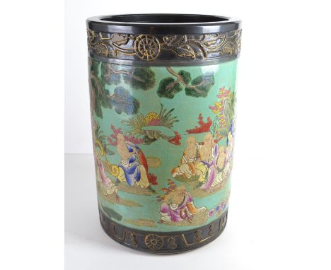 A large Chinese pottery cylindrical jardinière or stick stand, decorated in polychrome colours with immortals on a turquoise 