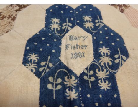 Mary Fisher, 1801, - A patchwork quilt of hexagonal tessellating pieces of printed cotton, with cotton fringing, with ball ta