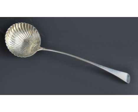 A large silver Georgian shell bowl ladle, London 1802, makers mark T.D in canted rectangle of Thomas Dicks, 33cm length, 168g