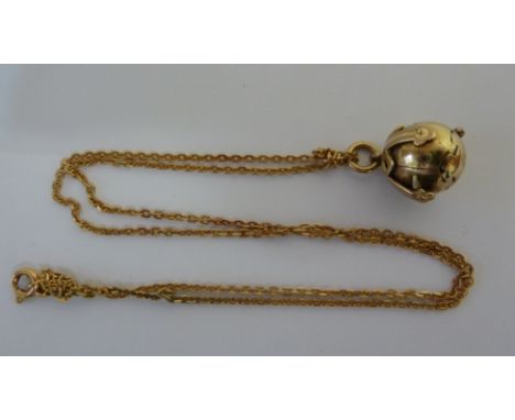 An antique gold and silver gilt cross pendant on chain, the ball opening up to reveal a sectional cross pendant, on a 18ct ye