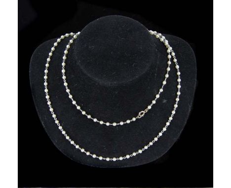 A pretty Edwardian natural pearl and platinum chain, c1910, composed of 118 small natural pearls threaded with platinum to a 