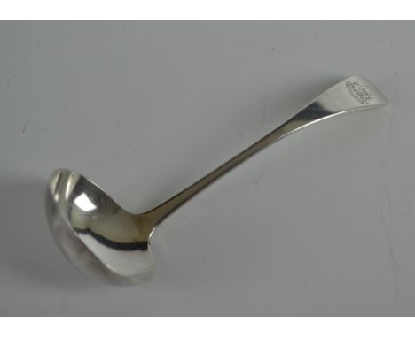 A Victorian silver sauce ladle, London 1874, maker mark RM over EH for Martin & Hall, the ladle crested with unicorn above 'F