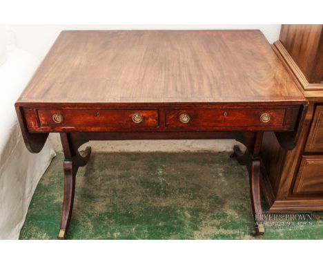 A George III mahogany rosewood, ebony and boxwood sofa table, c1805, the mahogany table and drop ends with rosewood and boxwo