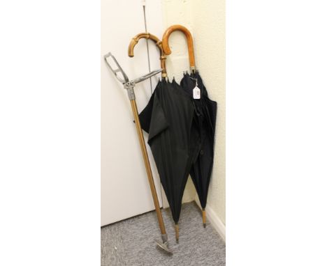 A vintage gentlemans umbrella together with one other umbrella; and a shooting stick