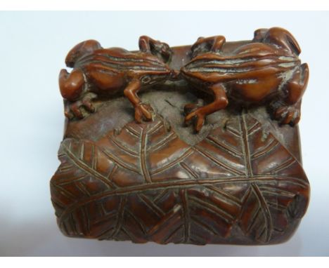 An unusual carved soapstone seal, Kangxi peroid, 19thC, the deep amber red coloured soapstone carved as a pair of frogs meeti