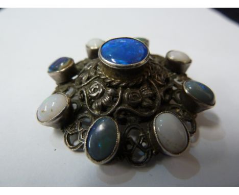 An antique Austrian black and white opal and silver brooch, c1900