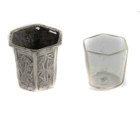 A Chinese silver inkwell, with glass liner of hexagonal section, each panel with characters, bamboo, prunus, grapes and other