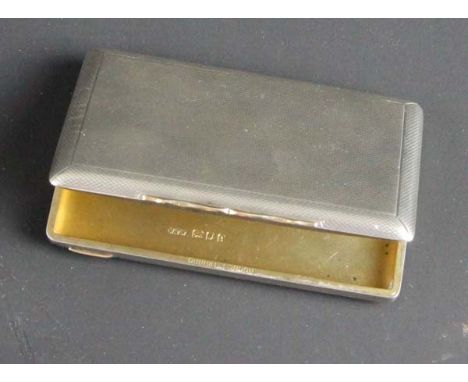 Dunhill London, a silver engine turned card case with gold push piece, London 1924 signed Dunhill London and inscribed inside