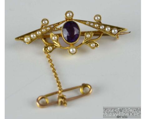 An Edwardian amethyst and split pearl brooch