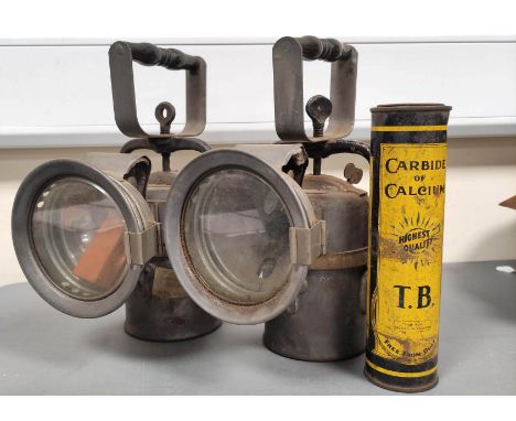 Two carbide Lamps by The Premier Lamp and Engineering Co Leeds with pewter bodies and wooden carry handles, one with military