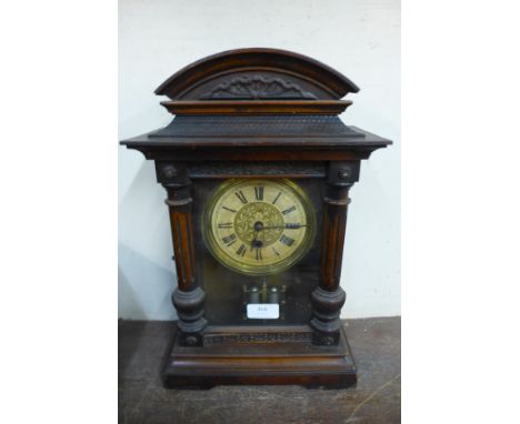 A 19th Century American beech mantel clock