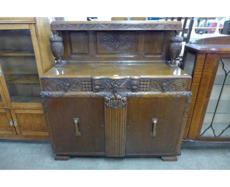 A carved oak buffet sideboard