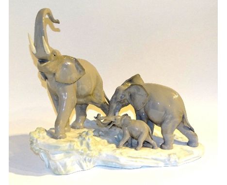 A Lladro figure group of a 'Family of Elephants', 28cm high   CONDITION REPORT:  Lot 104 - very minor chip to ear on large el
